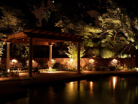 Sterling Lighting path lights and accent lights illuminating a front walkway